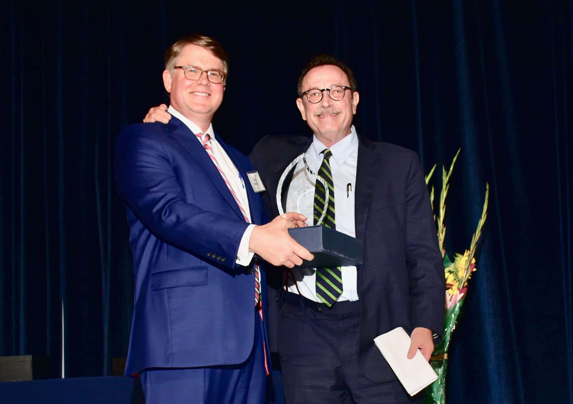 Robert Fickman receiving HCCLA's 2019 Torch of Liberty Award